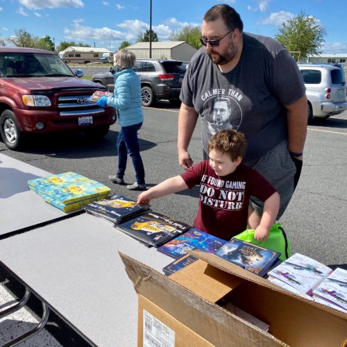 Parent and child at BBCC book donation