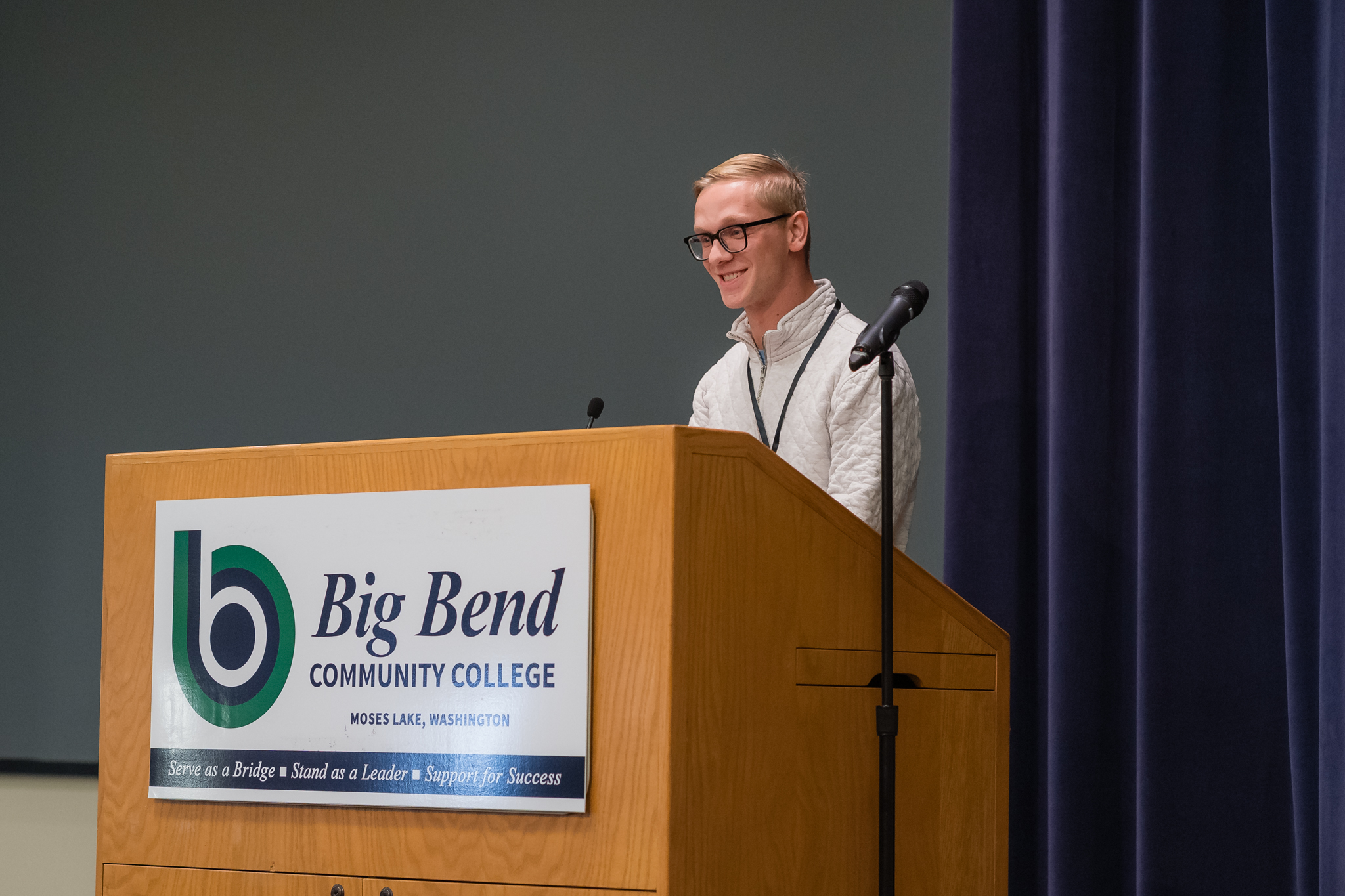Man at a Podium Smiling