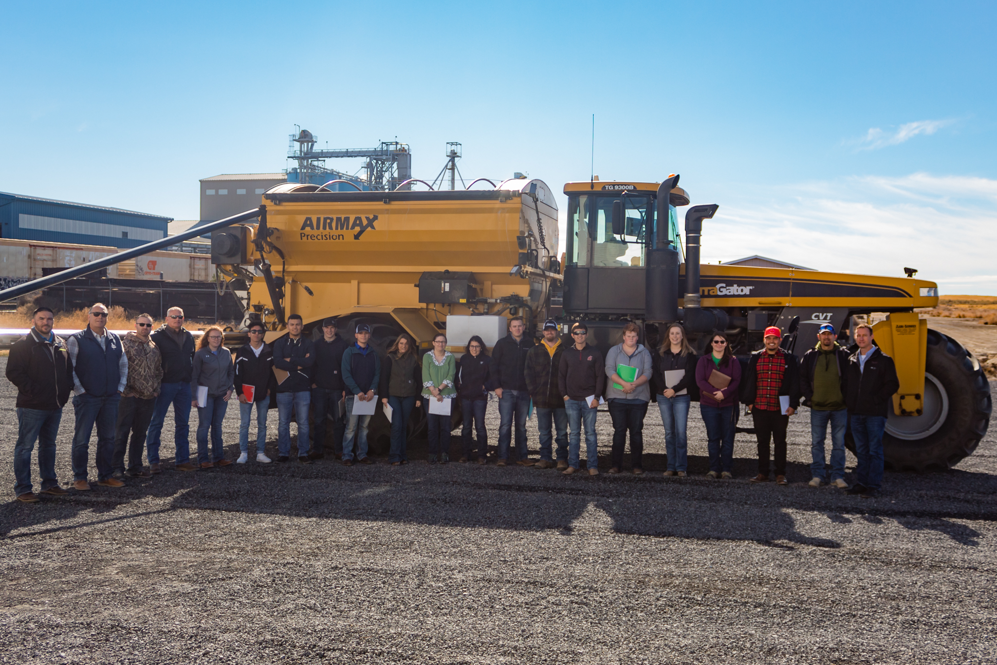 people standing infront of a big truck