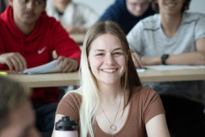 A student smiles during a filibuster in the mock Senate.