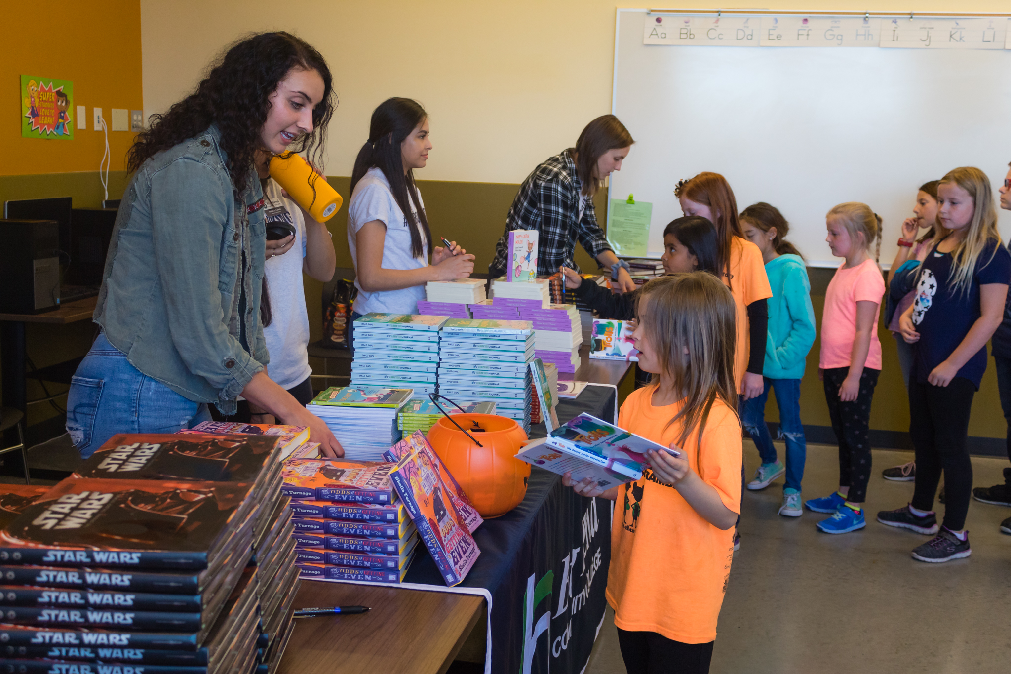 Big Bend donating books to boys and girls club.