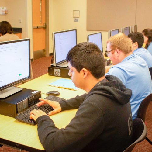 Students programming at challenge event Students programming at challenge event