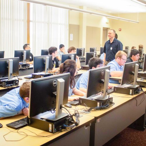 Students programming at challenge event-1 Students programming at challenge event