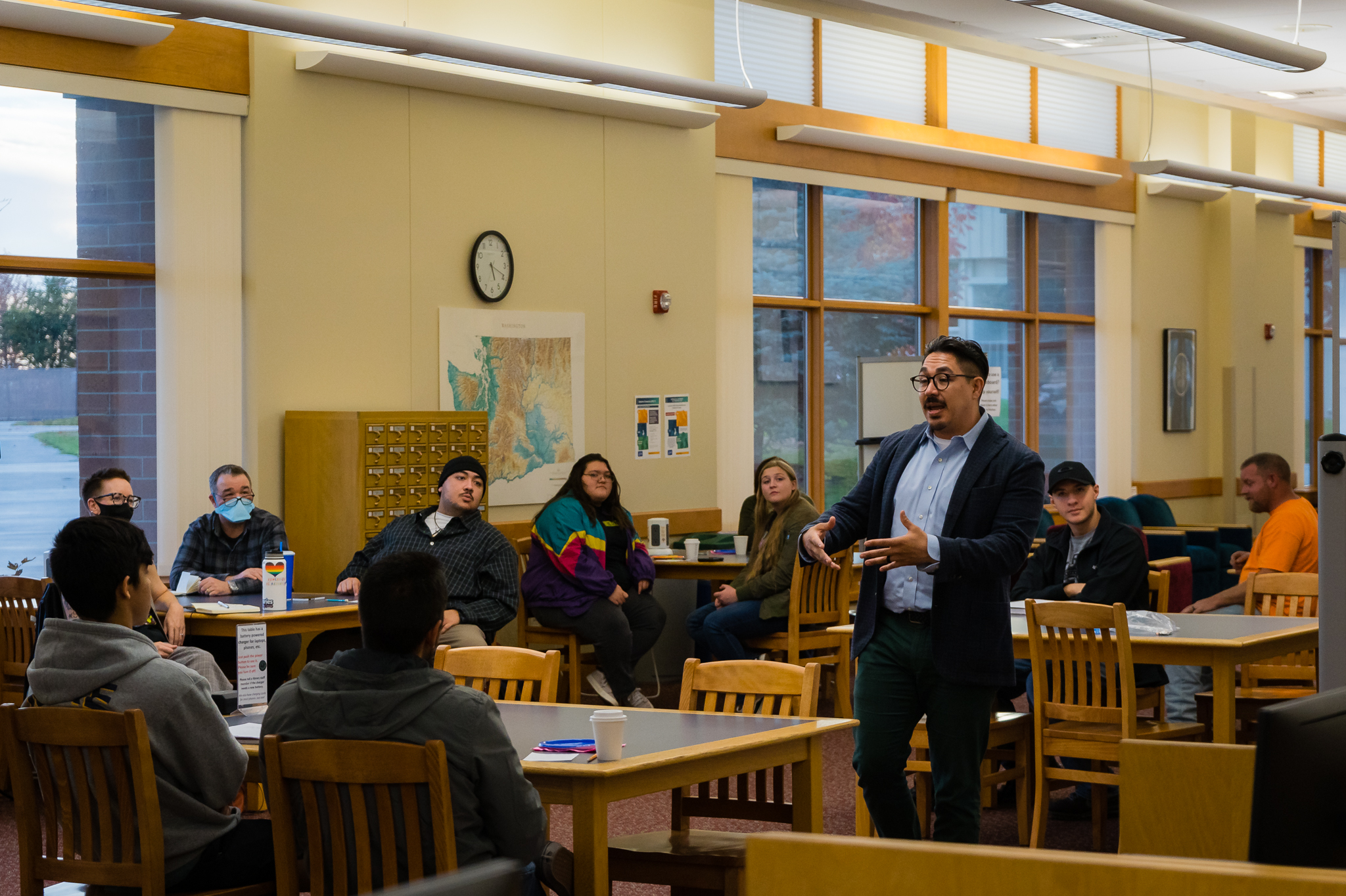 BBCC alum Ricardo Ruiz speaking to audience in library