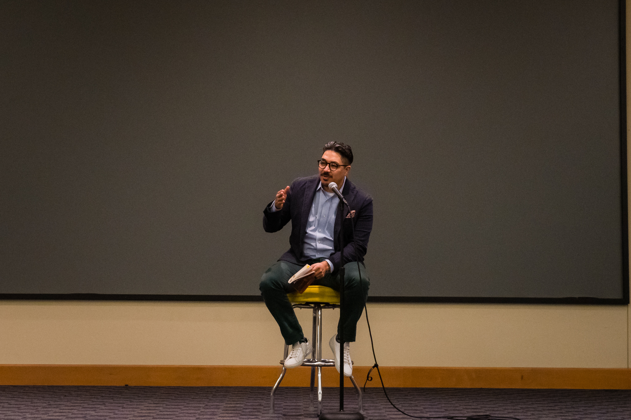 BBCC alum Ricardo Ruiz reads on stage