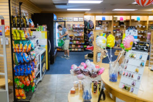 male student helping in bookstore